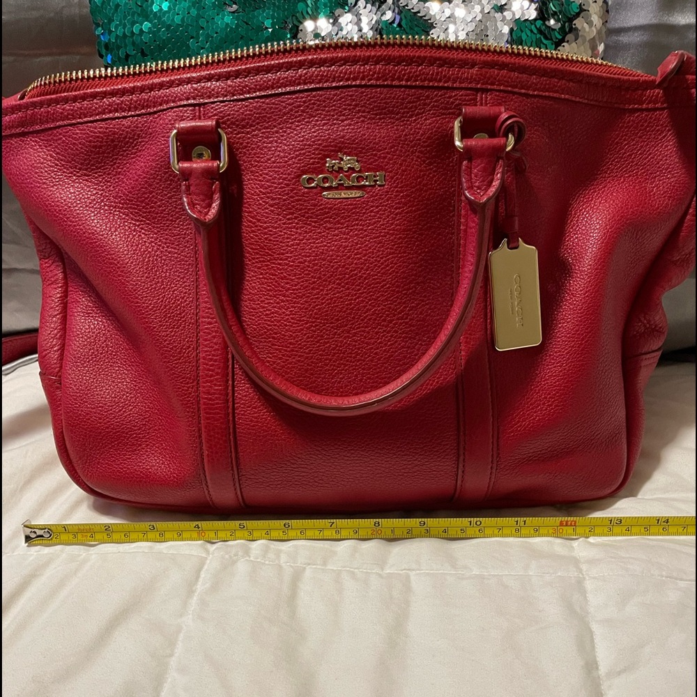 I have a red pebbled leather Coach purse for sale.
